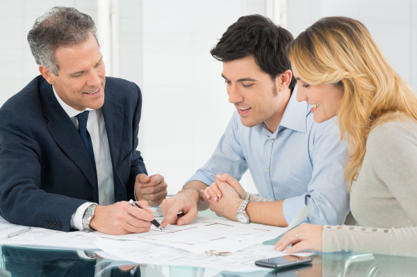 Insurance Agent Discussing Policy with Clients